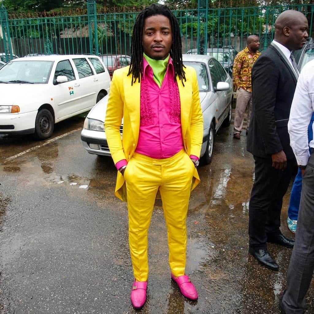 put man sitting down in yellow outfit matching lighting and stance of man in yellow outfit and location no glasses