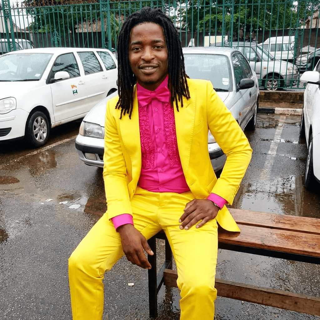put man sitting down in yellow outfit matching lighting and stance of man in yellow outfit and location no glasses