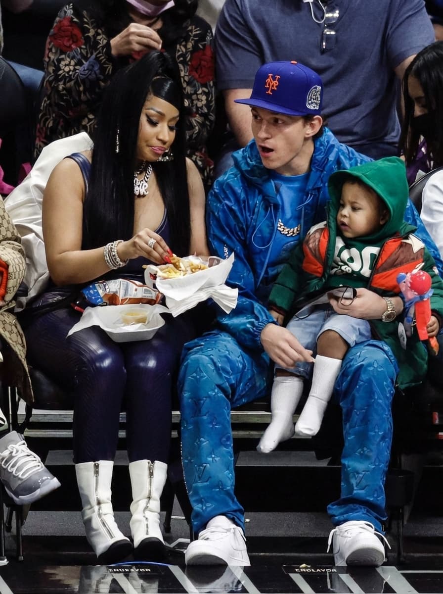 replace the people in this photo with tom holland and Zendeya Stoermer Coleman. make sure to remove all tatoos make it look ultra realstic and make sure all of their body matches the skin tone of who they are. keep them in the same outfits as the original.