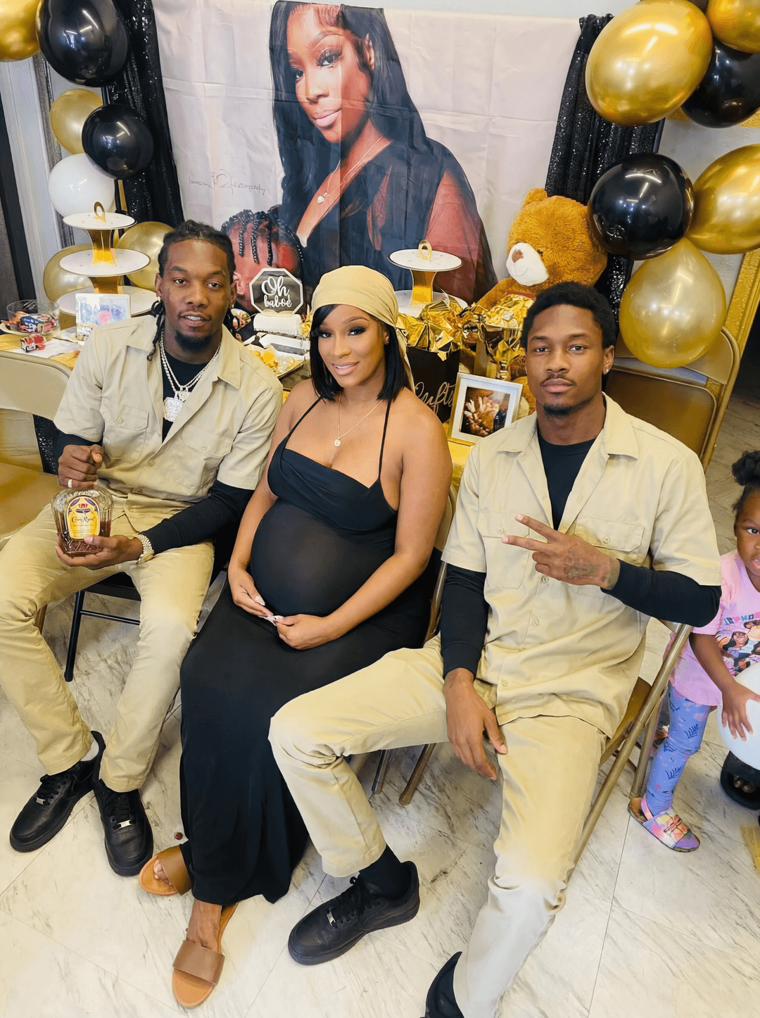 Completely remove and replace the people in this photo with offset as the man on the left and steffon diggs as the man on the right as the man and cardi b as the woman . make sure to remove all tatoos and headwear make it look ultra clean and make sure all of their body matches the skin tone of who they are. keep them in the same outfits as the original. make sure that the end result has cardib as the woman. also change the photo in the packground to be off cardi b