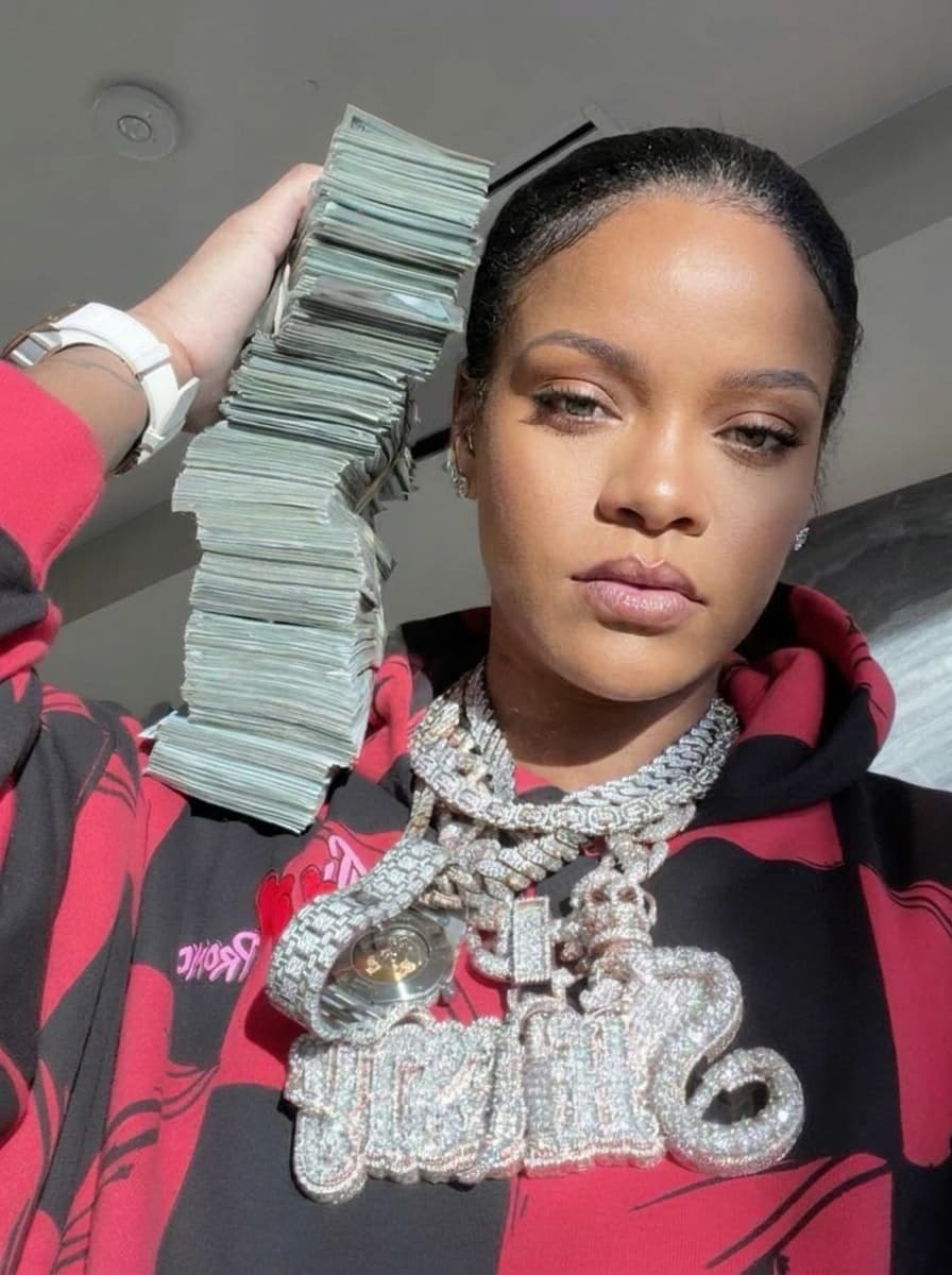 Use the provided image as the base reference. Maintain the exact same environment lighting, camera angle, pose, outfit structure, and composition from the original image.
Replace the original subject with Rihanna,Music Icon wearing outfits attached
