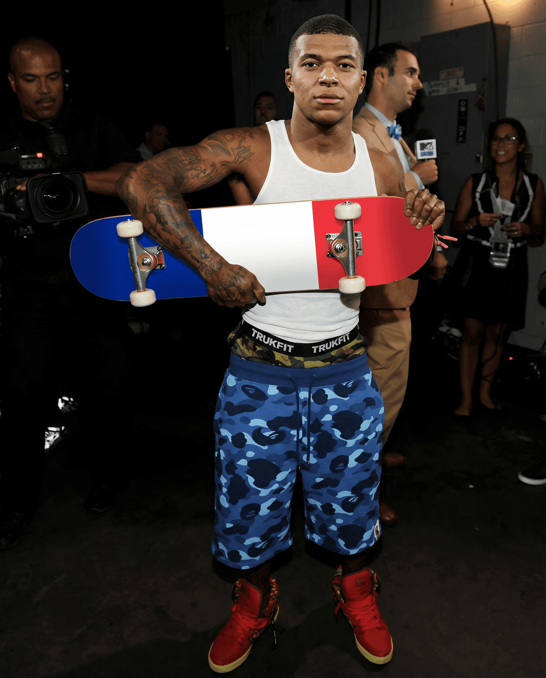 Keep everything the same. Swap character with mbappe white tank top, blue camo bape shorts. 4k resolution, realistic skin texture. Skateboard is france flag design.