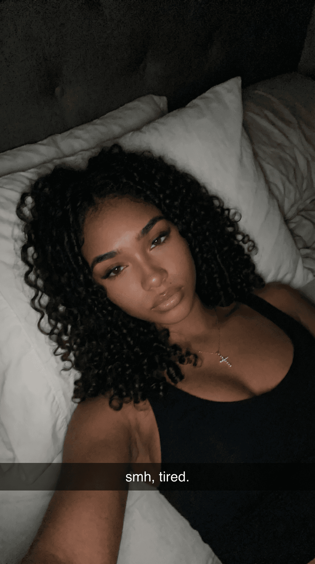 Make a unique combination of these females on a bed selfie like Snapchat baddies upward postion while she laid back in bed with a darker background quality can be little shaky but clear like a realistic bed selfie would b but nonchalant expression 