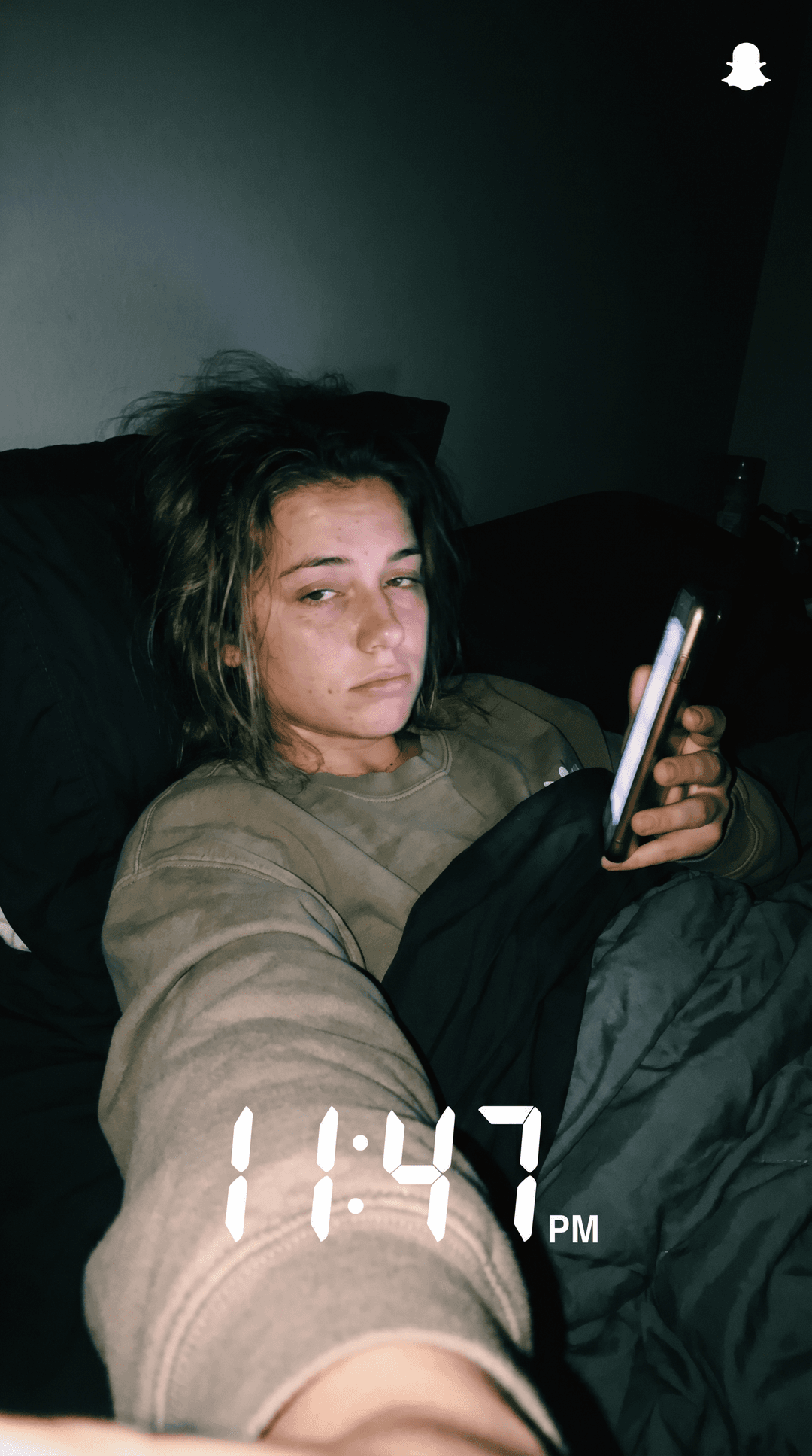 Make a unique combination of these females on a bed selfie like Snapchat baddies upward postion while she laid back in bed with a darker background quality can be little shaky but clear like a realistic bed selfie  but exhausted expression 