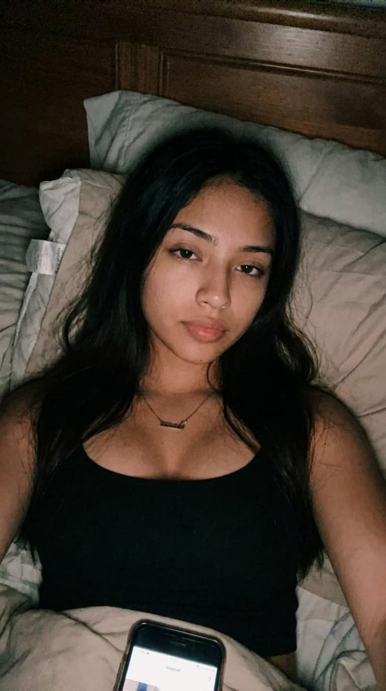 Make a unique combination of these females on a bed selfie like Snapchat baddies upward postion while she laid back in bed with a darker background quality can be little shaky but clear like a realistic bed selfie would b but nonchalant expression not too much make up we want a realism look