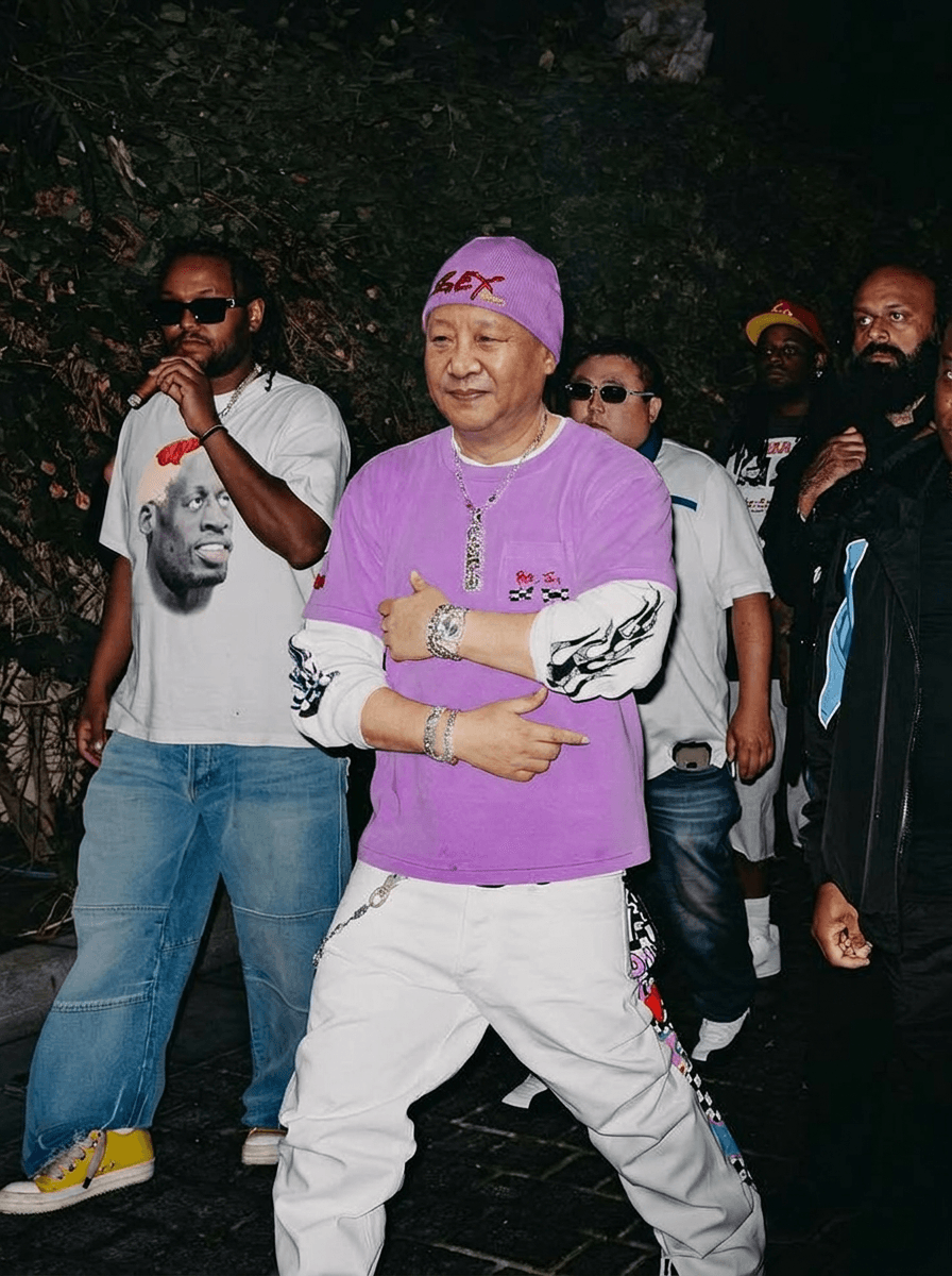 Use the provided image as the base reference. Maintain the exact same environment lighting, camera angle, pose, outfit structure, and composition from the original image.
Replace the original subject with Xi Jinping,Political Leader wearing outfits attached
